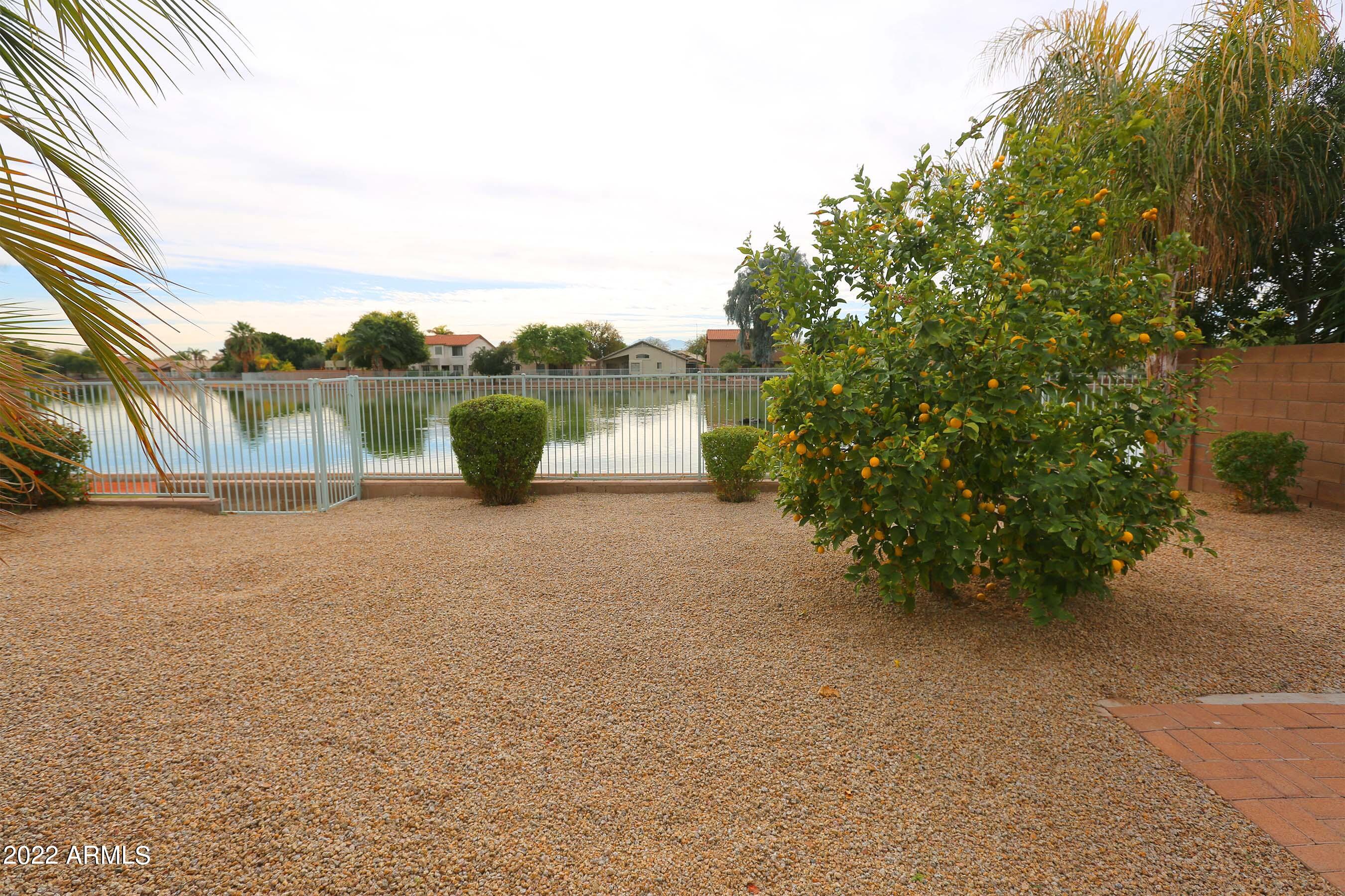 11217 West Edgemont Avenue Avondale, AZ 85392 - Photo 33 of 47 a view of a lake with an outdoor space