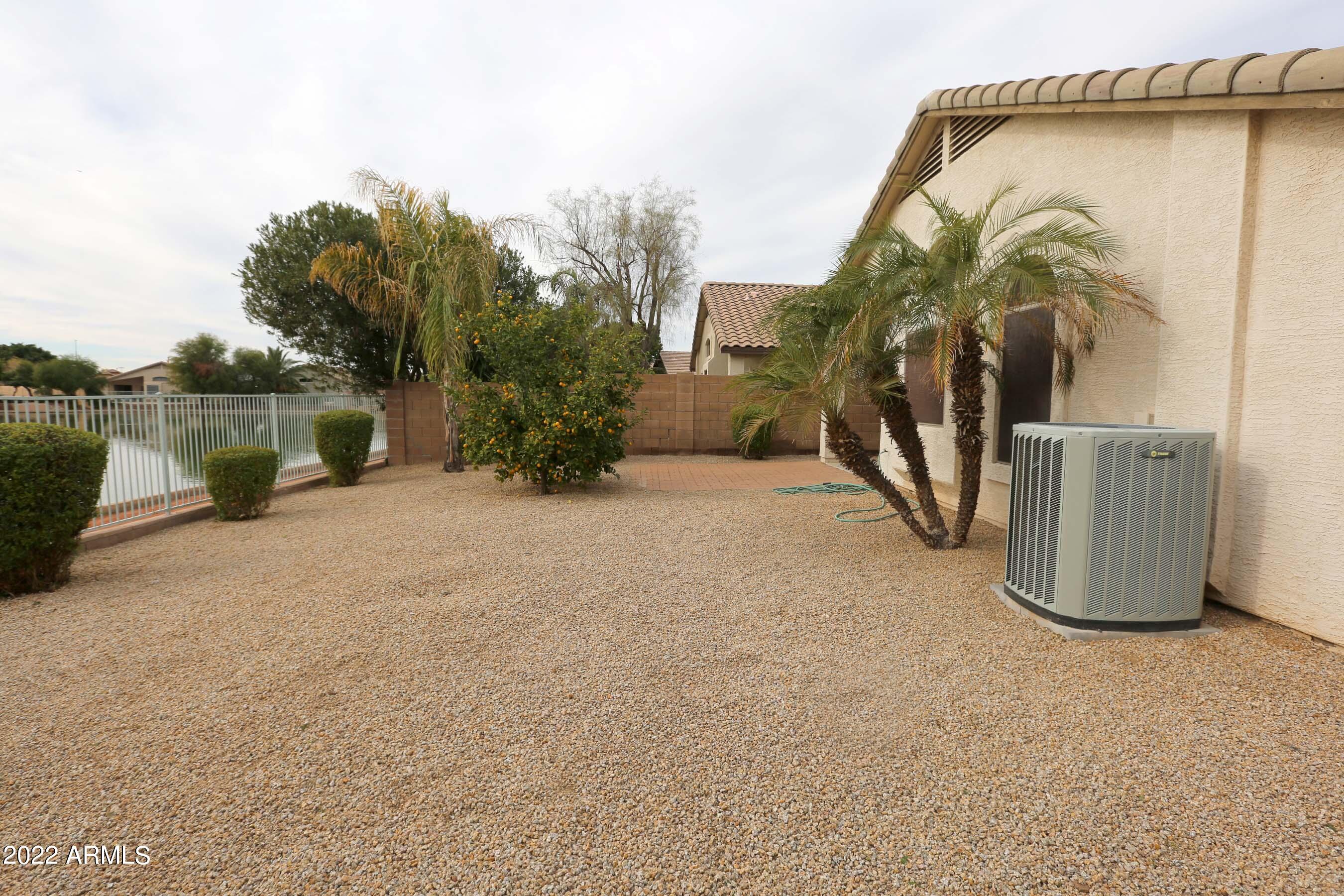 11217 West Edgemont Avenue Avondale, AZ 85392 - Photo 36 of 47 a view of a house with a yard