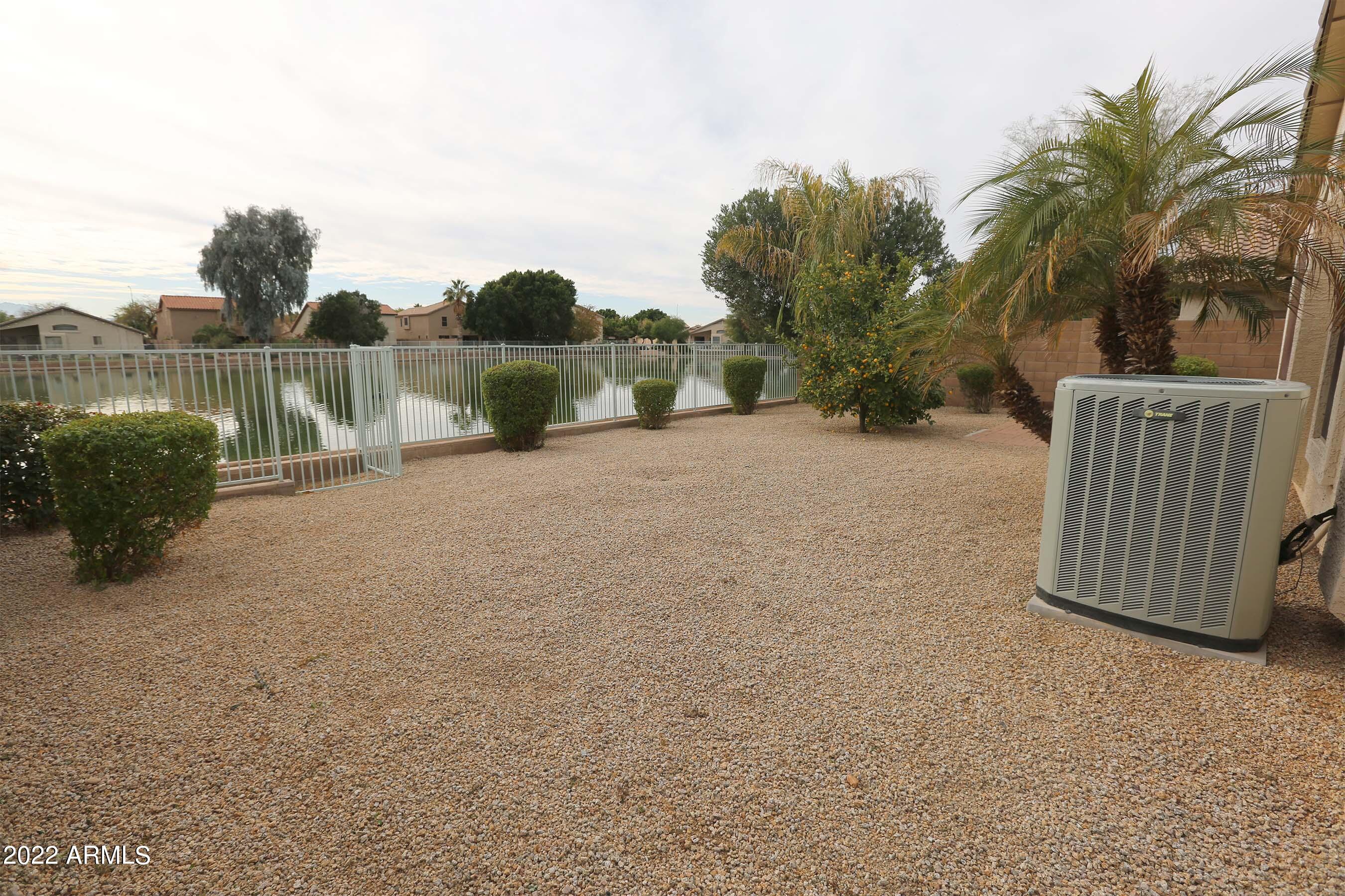 11217 West Edgemont Avenue Avondale, AZ 85392 - Photo 40 of 47 a backyard of a house with table and chairs