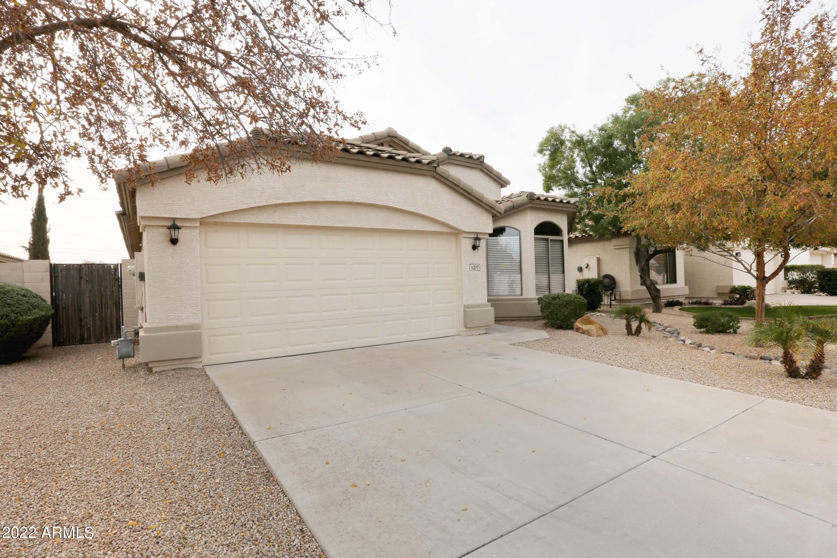 11217 West Edgemont Avenue Avondale, AZ 85392 - Photo 4 of 47 a view of garage and yard