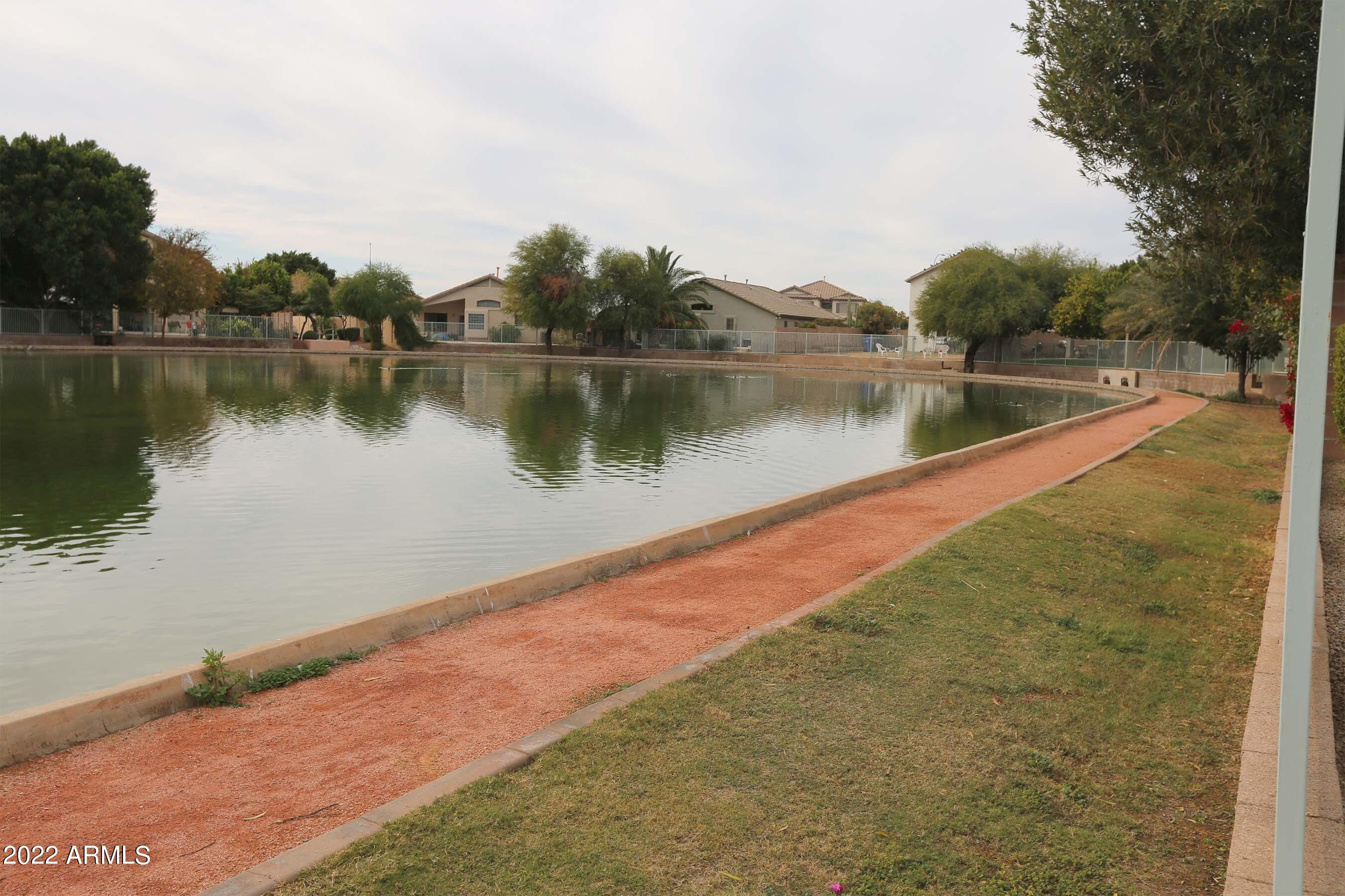 11217 West Edgemont Avenue Avondale, AZ 85392 - Photo 42 of 47 a view of a lake with houses in the background