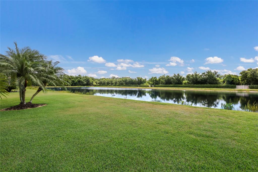 5011 Tobermory Way Bradenton, FL 34211 - Photo 29 of 77 a view of a lake with houses in the background