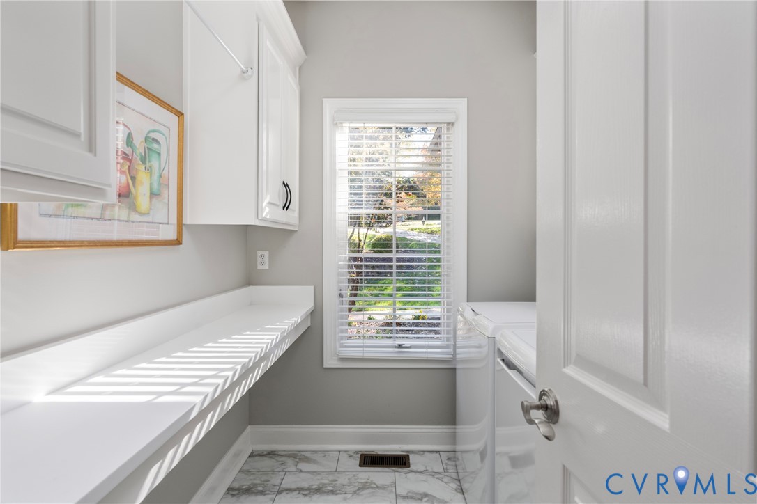 5304 Beechwood Point Court Midlothian, VA 23112 - Photo 20 of 50 a bathroom with a bathtub and next to a window