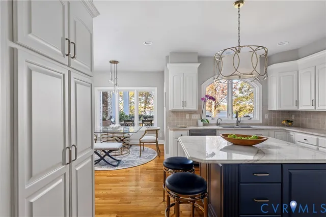 a kitchen with sink cabinets and dining table