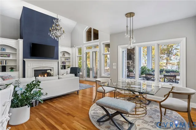 a living room with furniture fireplace and flat screen tv