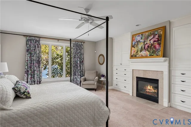 a bedroom with a bed and a fireplace
