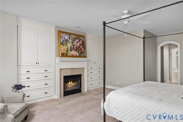 a bed room with a bed and a fireplace