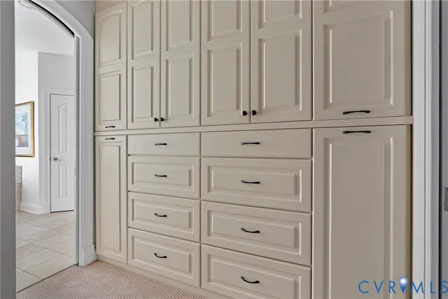 a spacious bathroom with a bathtub sink and mirror