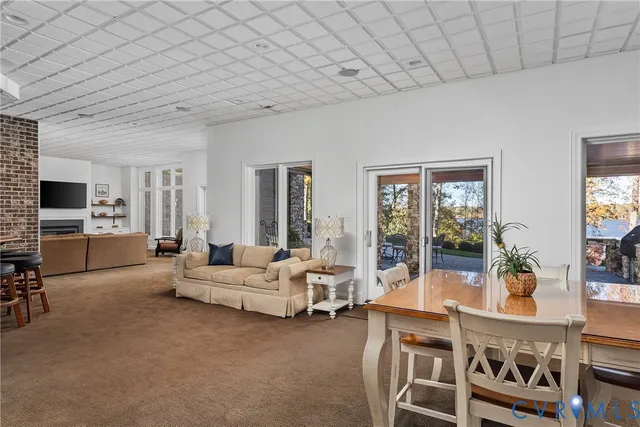 a view of a livingroom with furniture and a flat screen tv