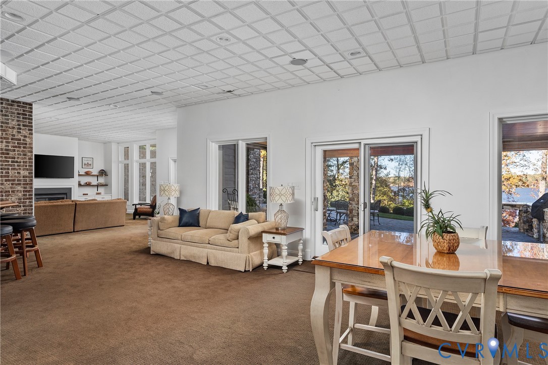 5304 Beechwood Point Court Midlothian, VA 23112 - Photo 37 of 50 a living room with furniture a flat screen tv and a table