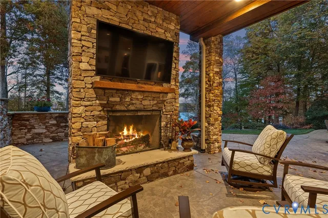 a view of a patio with a dining table and chairs with wooden floor