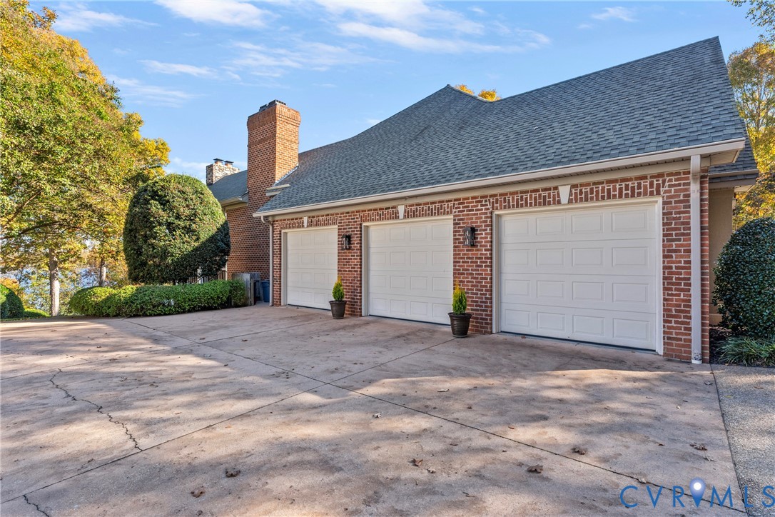 5304 Beechwood Point Court Midlothian, VA 23112 - Photo 10 of 50 a front view of a house with a yard and garage