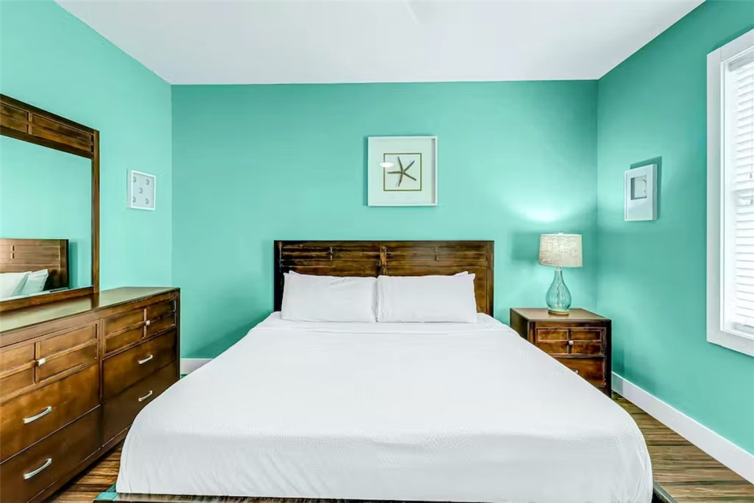 14307 Kemps Way Corpus Christi, TX 78418 - Photo 11 of 23 a bedroom with a bed and a table in it