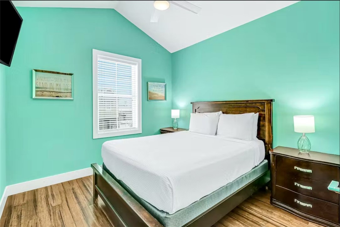 14307 Kemps Way Corpus Christi, TX 78418 - Photo 14 of 23 a bedroom with a bed and a window