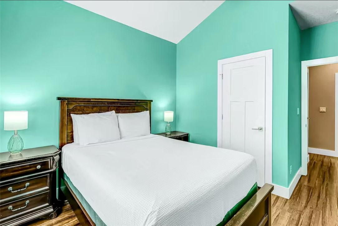 14307 Kemps Way Corpus Christi, TX 78418 - Photo 15 of 23 a bedroom with a bed and a night stand