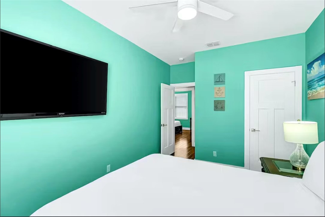 14307 Kemps Way Corpus Christi, TX 78418 - Photo 17 of 23 a bedroom with a bed and a flat screen tv