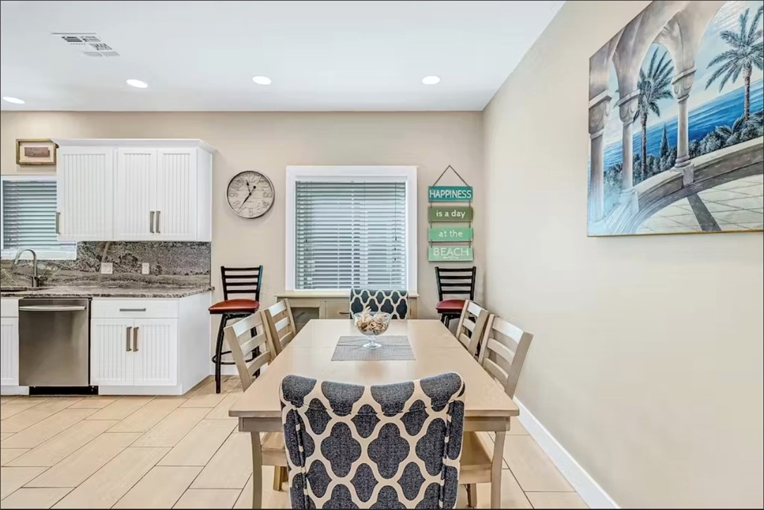 14307 Kemps Way Corpus Christi, TX 78418 - Photo 6 of 23 a dining hall with stainless steel appliances kitchen island granite countertop a sink and a white cabinets