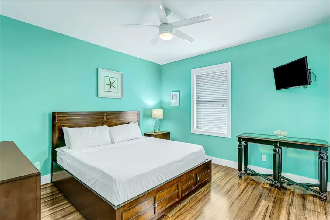 14307 Kemps Way Corpus Christi, TX 78418 - Photo 10 of 23 a bedroom with a bed and a flat screen tv