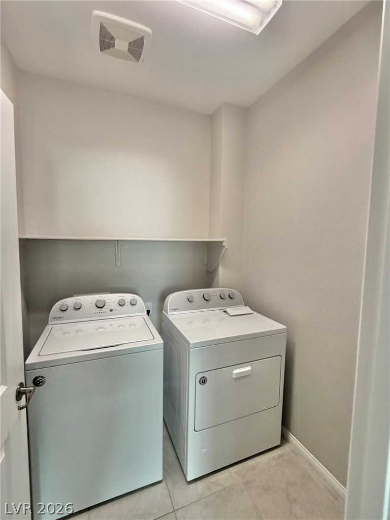 9953 Tucket Point Court Las Vegas, NV 89178 - Photo 13 of 22 A dedicated laundry space provides optimal functionality and convenience.