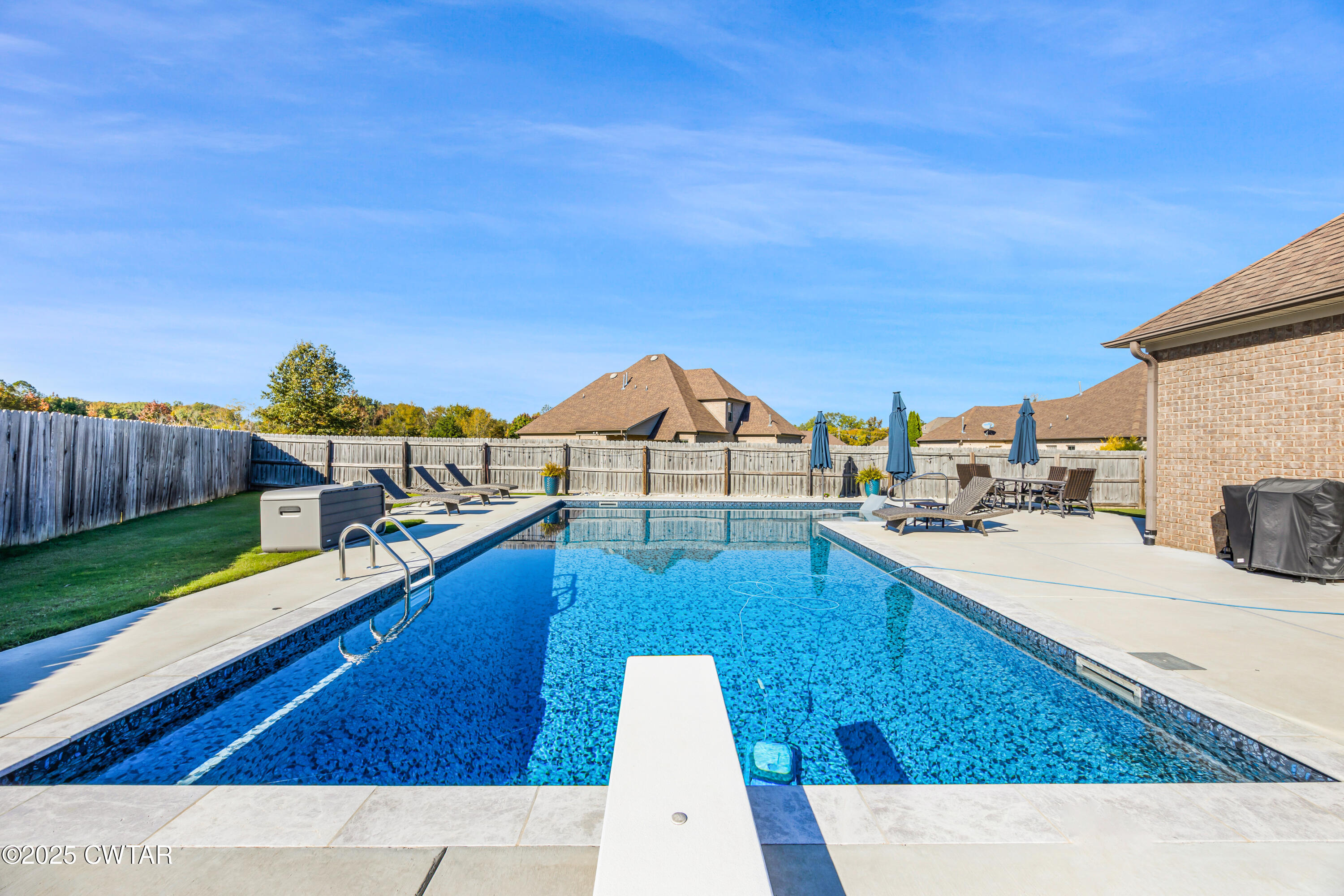 a view of a swimming pool with a lounge chairs