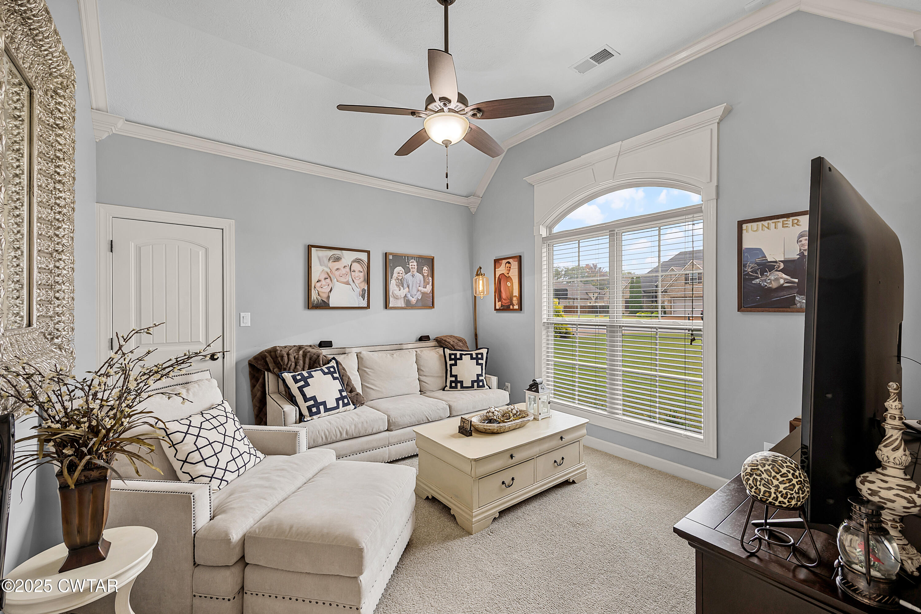 31 Perrington Cove Jackson, TN 38305 - Photo 19 of 27 a living room with furniture large window and flat screen tv