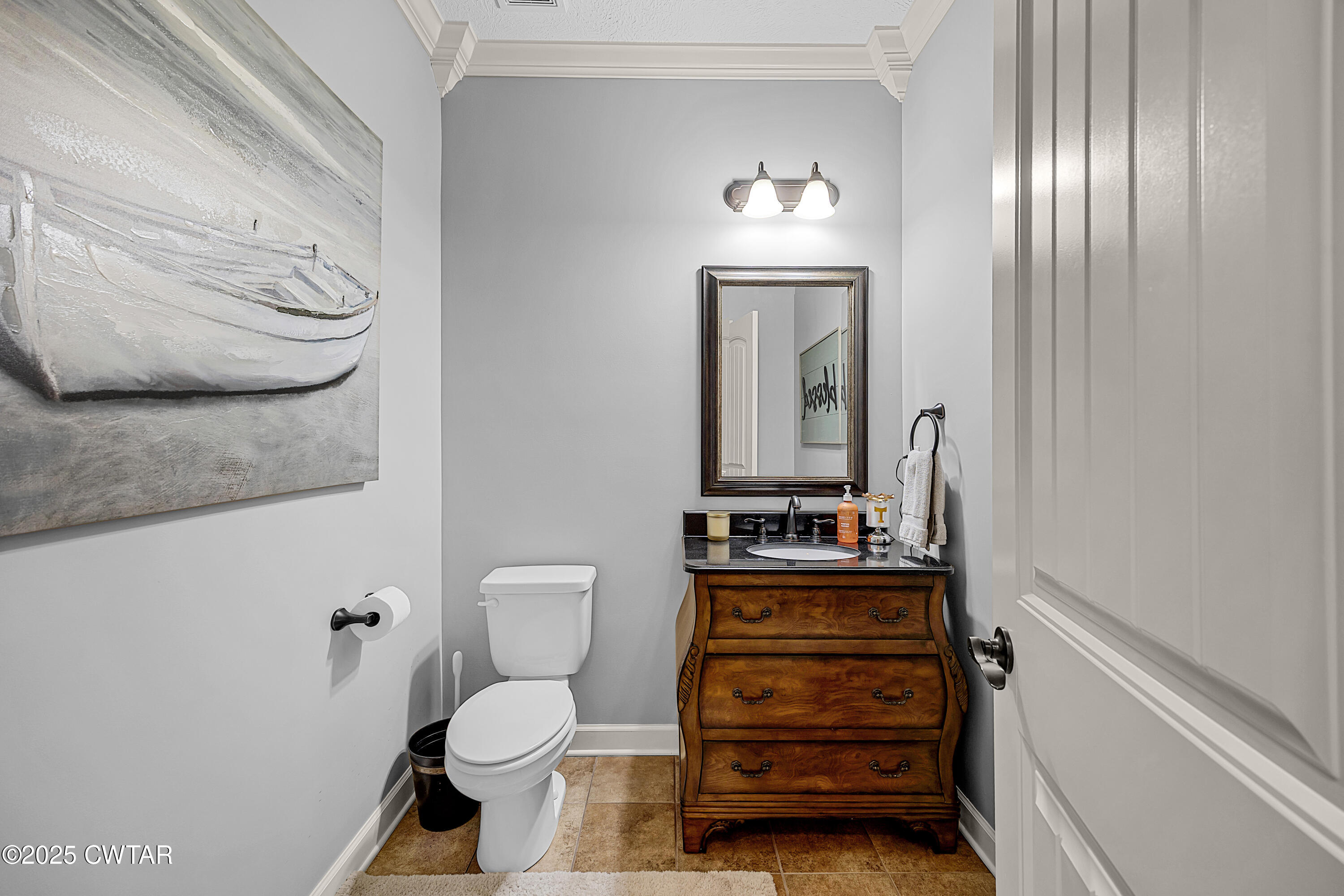 31 Perrington Cove Jackson, TN 38305 - Photo 20 of 27 a bathroom with a toilet a sink and mirror