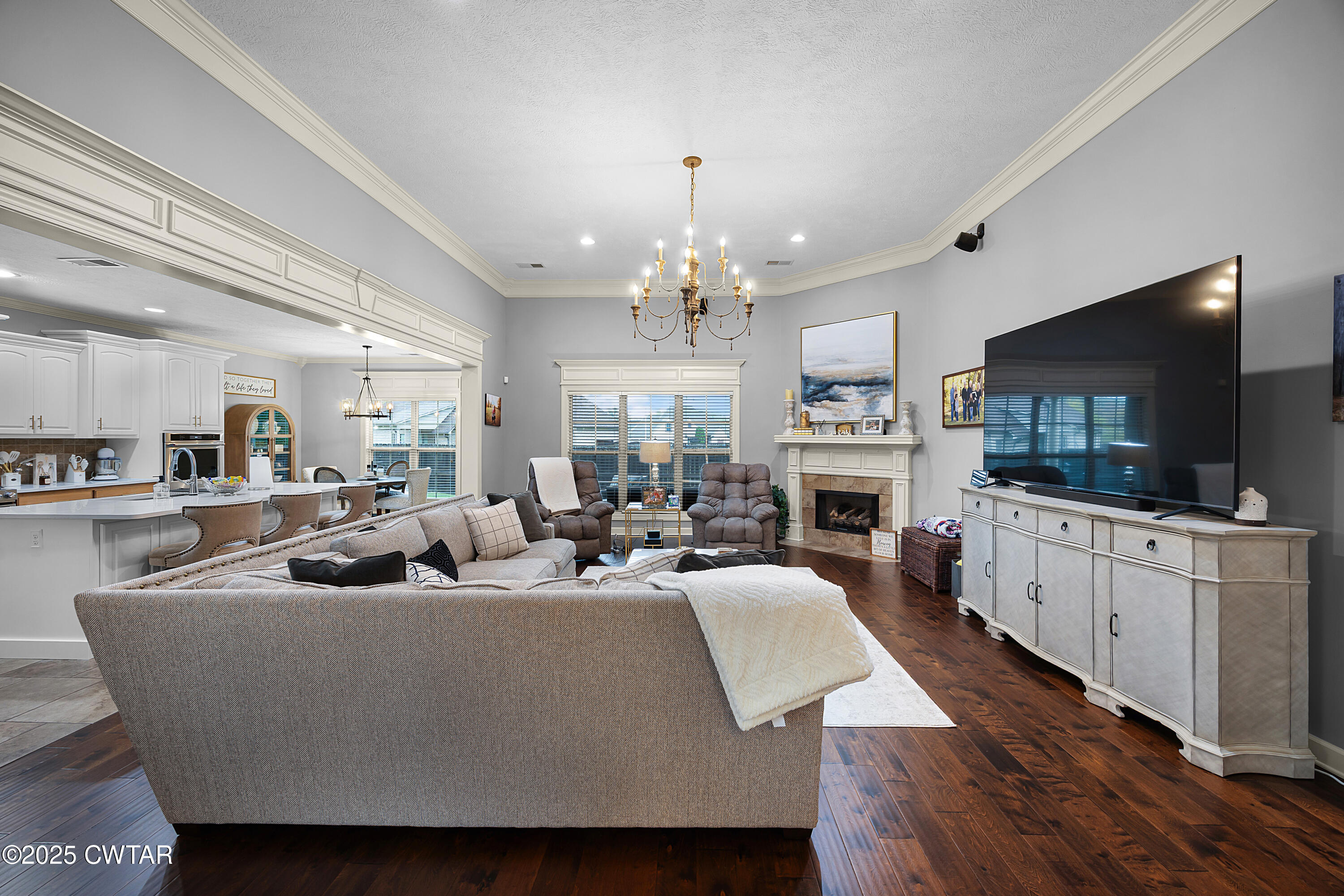 31 Perrington Cove Jackson, TN 38305 - Photo 4 of 27 a living room with fireplace furniture and a flat screen tv