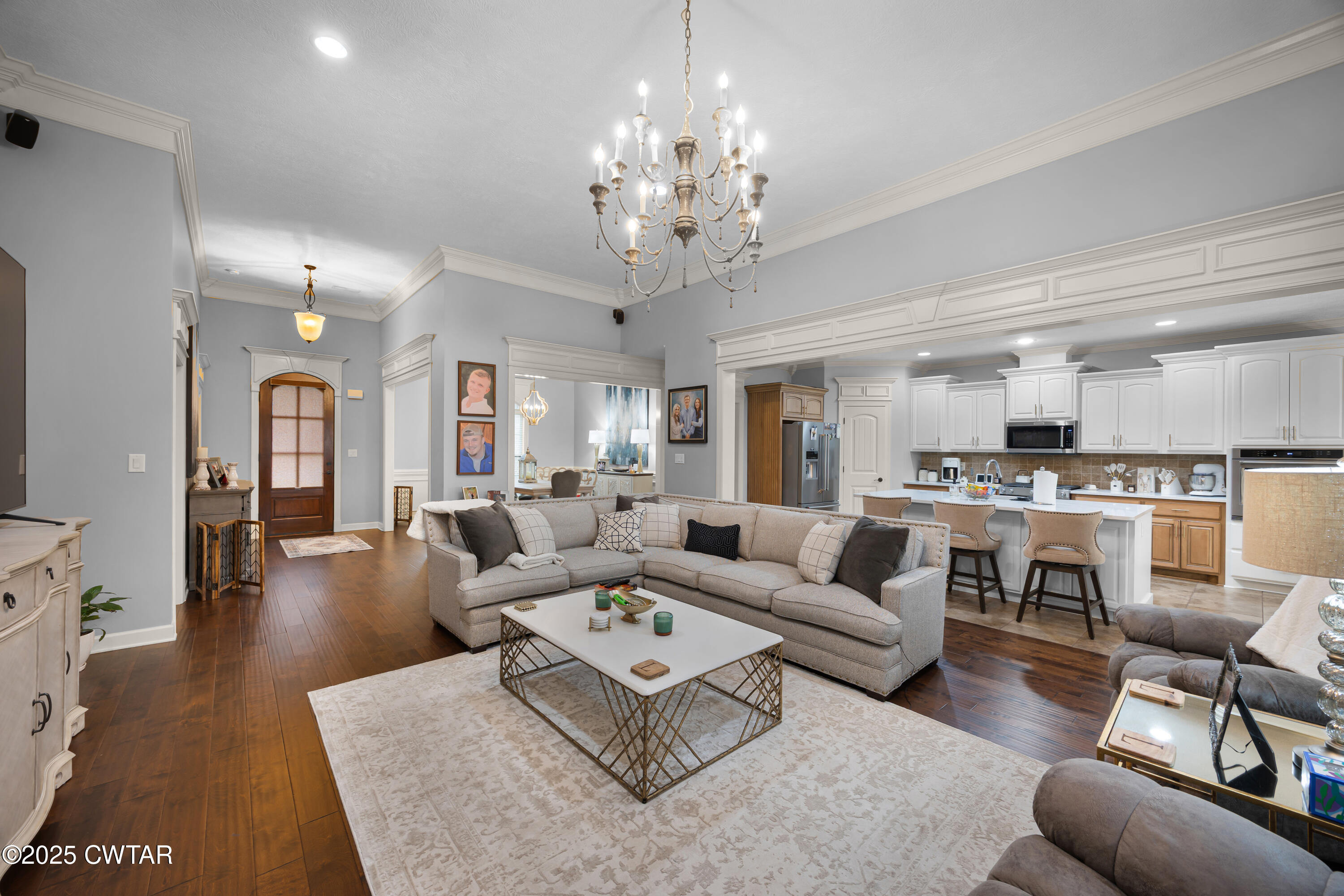 31 Perrington Cove Jackson, TN 38305 - Photo 5 of 27 a living room with furniture or kitchen view and a chandelier