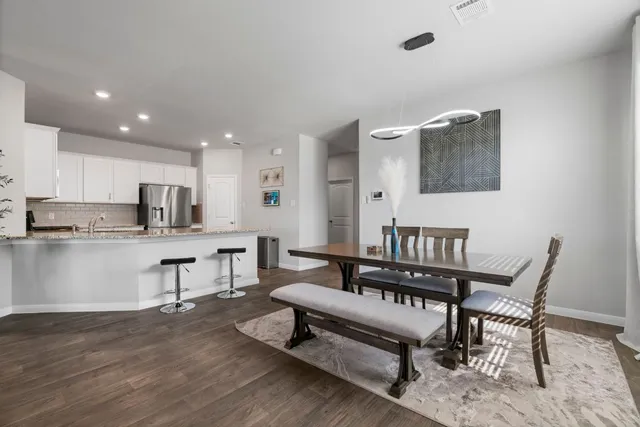 a view of kitchen with cabinets and wooden floor
