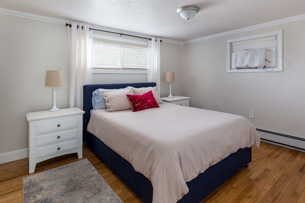 118 Wilkinson Street Worcester, MA 01606 - Photo 11 of 26 a bedroom with a bed and window