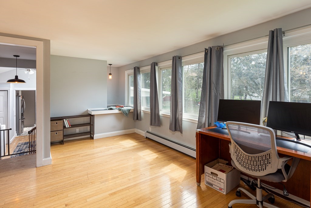 118 Wilkinson Street Worcester, MA 01606 - Photo 18 of 26 a living room with furniture and a floor to ceiling window