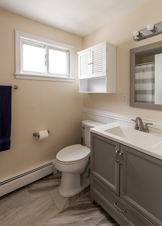 118 Wilkinson Street Worcester, MA 01606 - Photo 22 of 26 a bathroom with a sink toilet and window