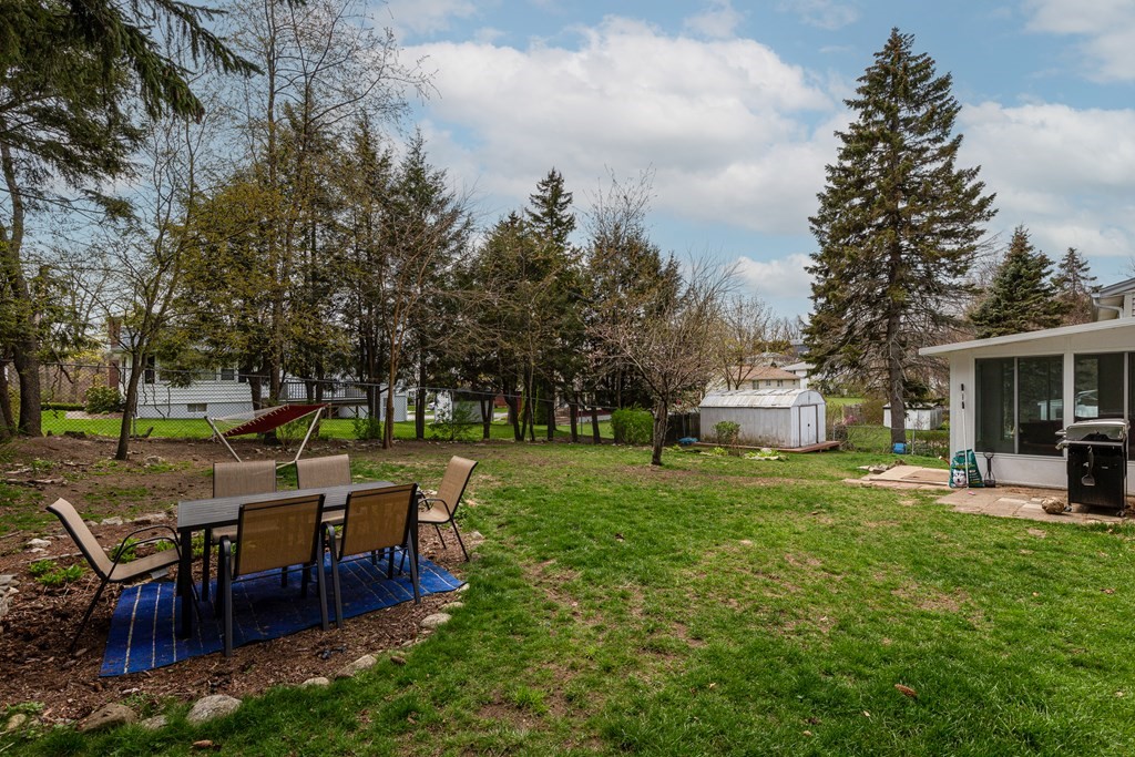 118 Wilkinson Street Worcester, MA 01606 - Photo 25 of 26 a view of a house with backyard porch and sitting area