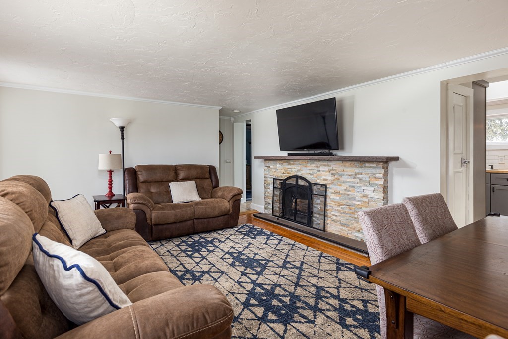 118 Wilkinson Street Worcester, MA 01606 - Photo 5 of 26 a living room with furniture and a flat screen tv