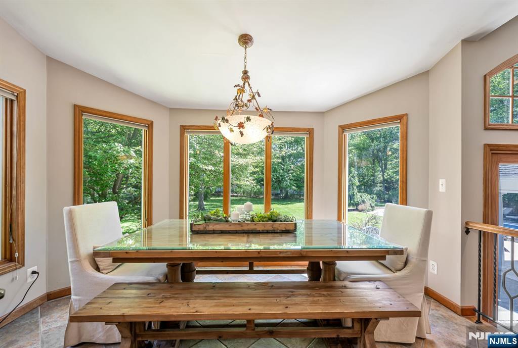 411 Snyder Road Wyckoff, NJ 07481 - Photo 10 of 36 a living room with furniture and large windows
