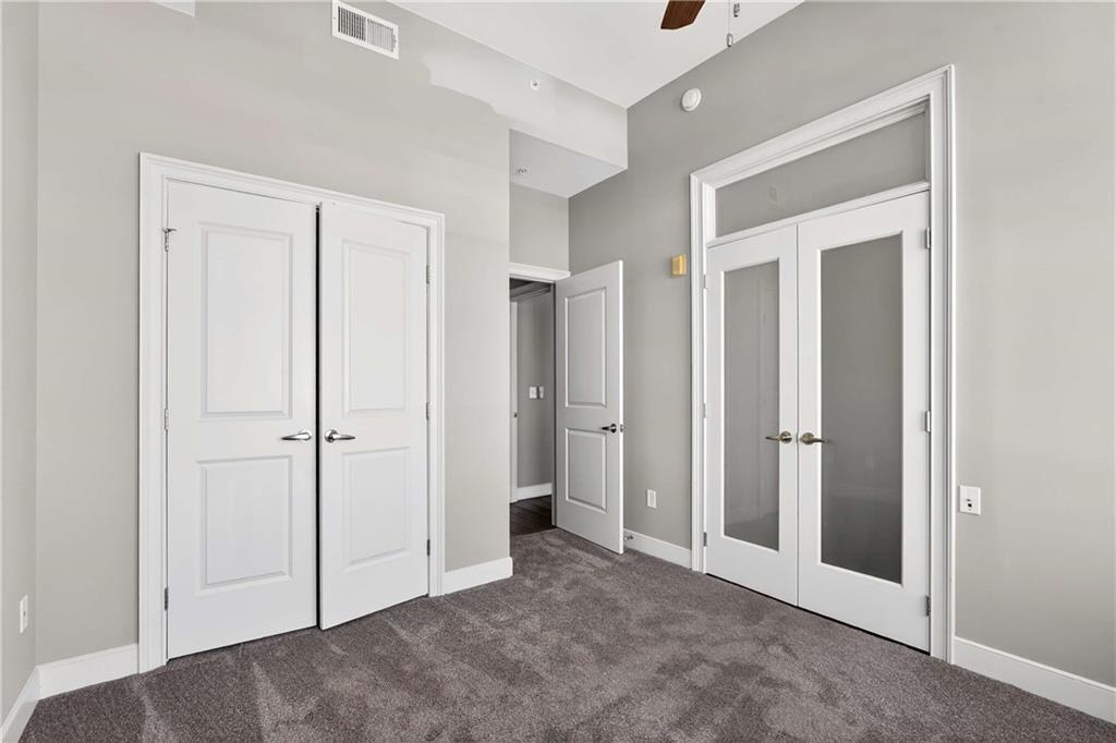 201 West Ponce De Leon Avenue, Unit 702 Decatur, GA 30030 - Photo 17 of 41 an empty room with closet and a bathroom