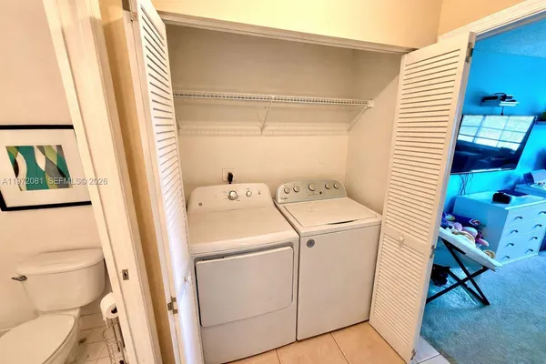 a utility room with dryer and washer