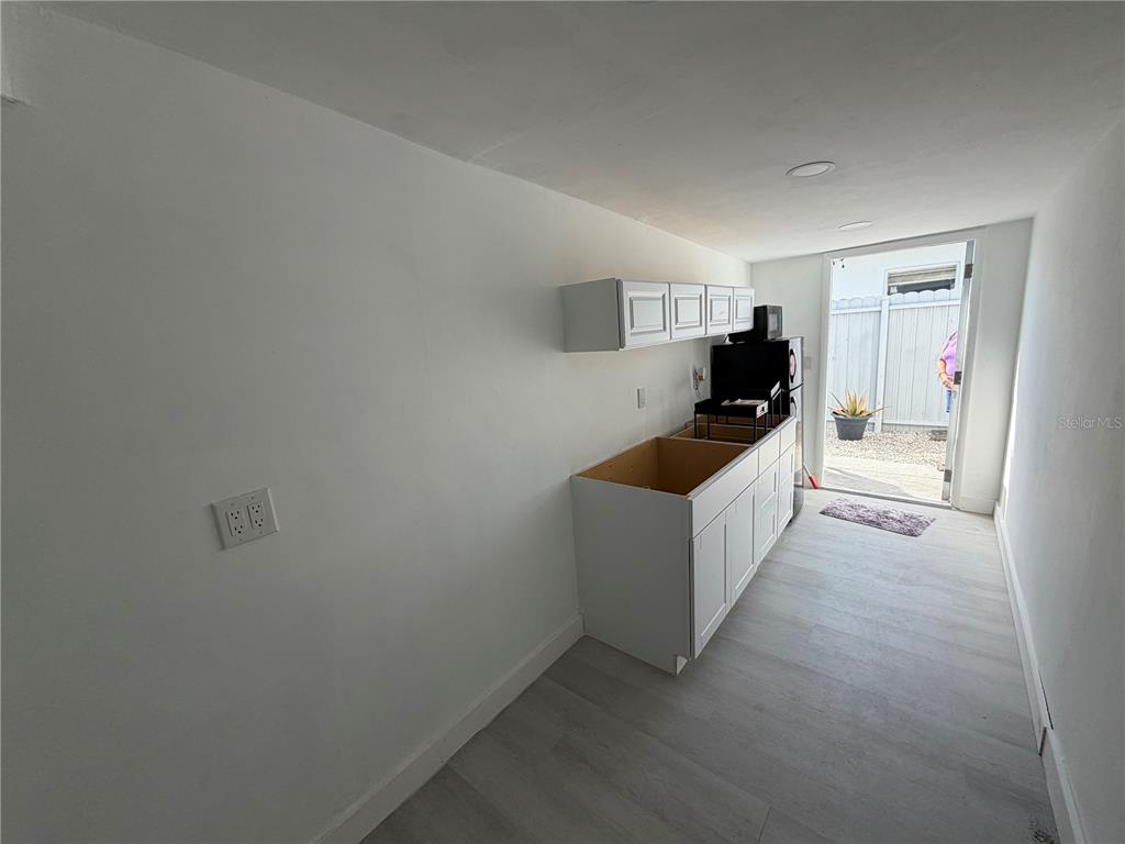 126 Miami Gardens Road West Park, FL 33023 - Photo 12 of 55 a kitchen with sink cabinets and stove top oven