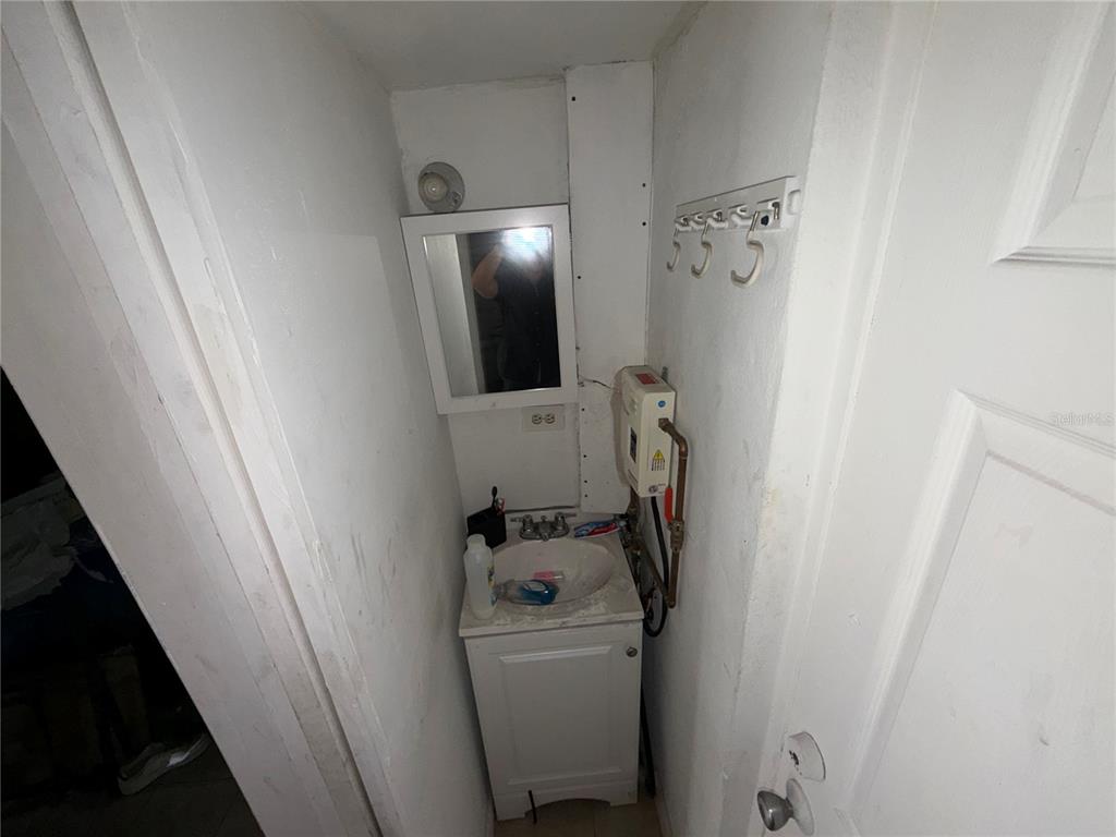 126 Miami Gardens Road West Park, FL 33023 - Photo 26 of 55 a bathroom with a sink and shower