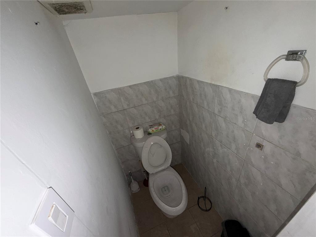 126 Miami Gardens Road West Park, FL 33023 - Photo 27 of 55 a bathroom with a toilet and a sink