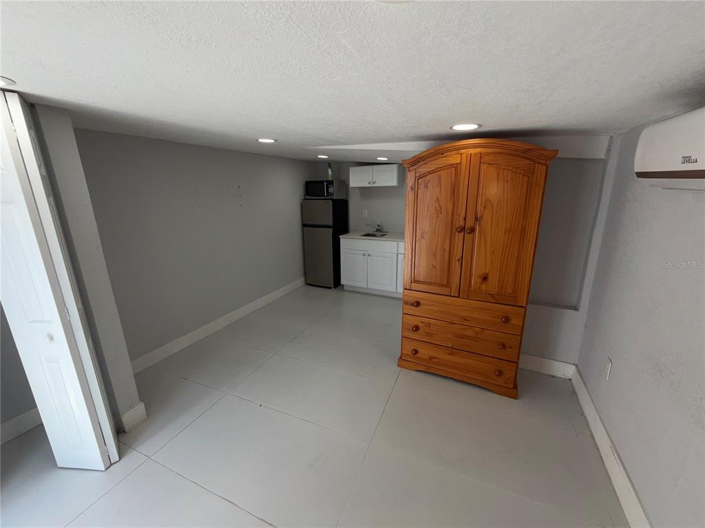 126 Miami Gardens Road West Park, FL 33023 - Photo 31 of 55 an empty room with furniture and wooden floor