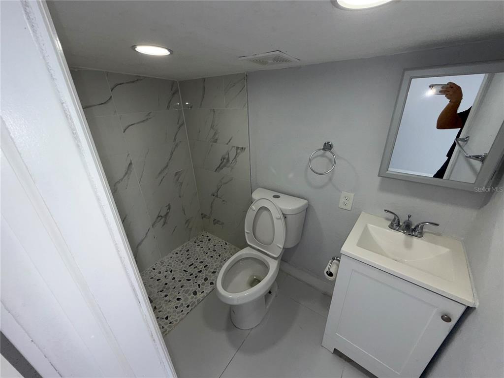 126 Miami Gardens Road West Park, FL 33023 - Photo 32 of 55 a bathroom with a sink toilet and shower