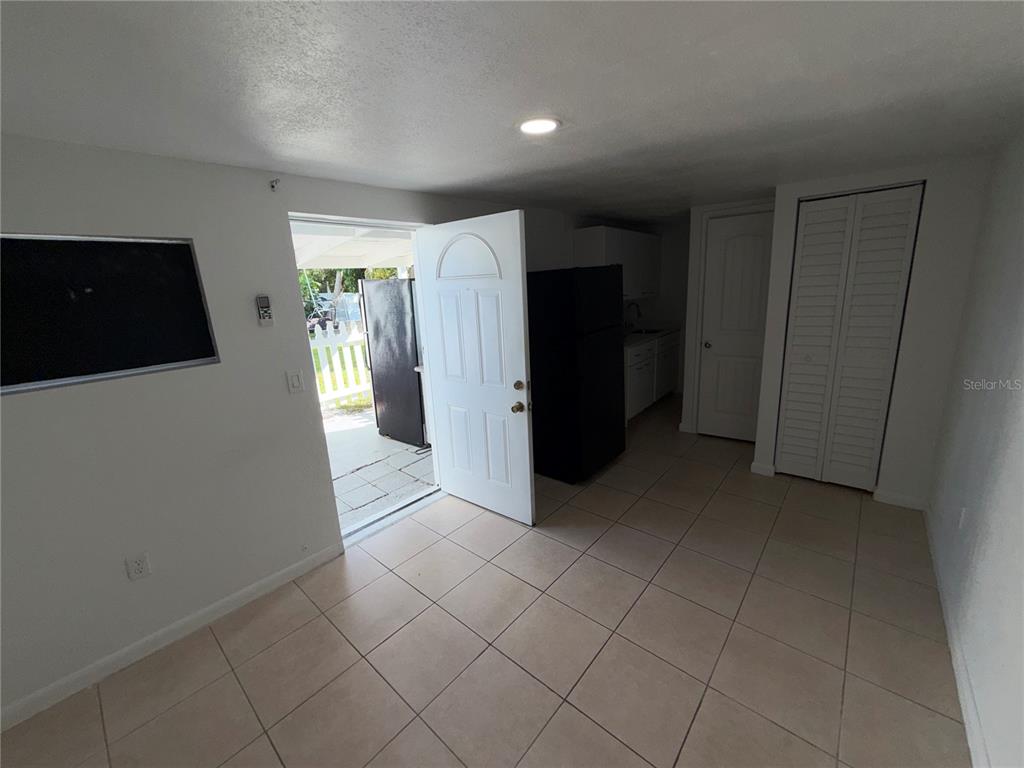 126 Miami Gardens Road West Park, FL 33023 - Photo 36 of 55 a view of a storage & utility room with refrigerator and window