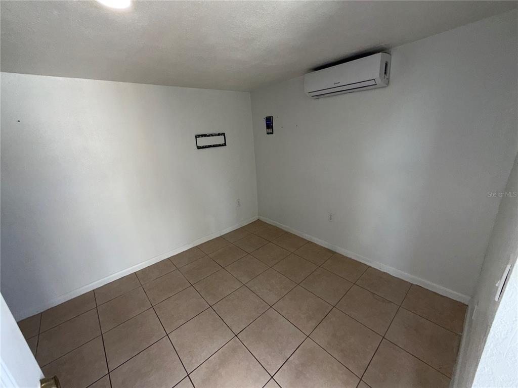 126 Miami Gardens Road West Park, FL 33023 - Photo 37 of 55 a view of a room with racks on the wall