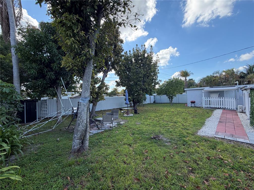 126 Miami Gardens Road West Park, FL 33023 - Photo 39 of 55 a view of a backyard with tree s