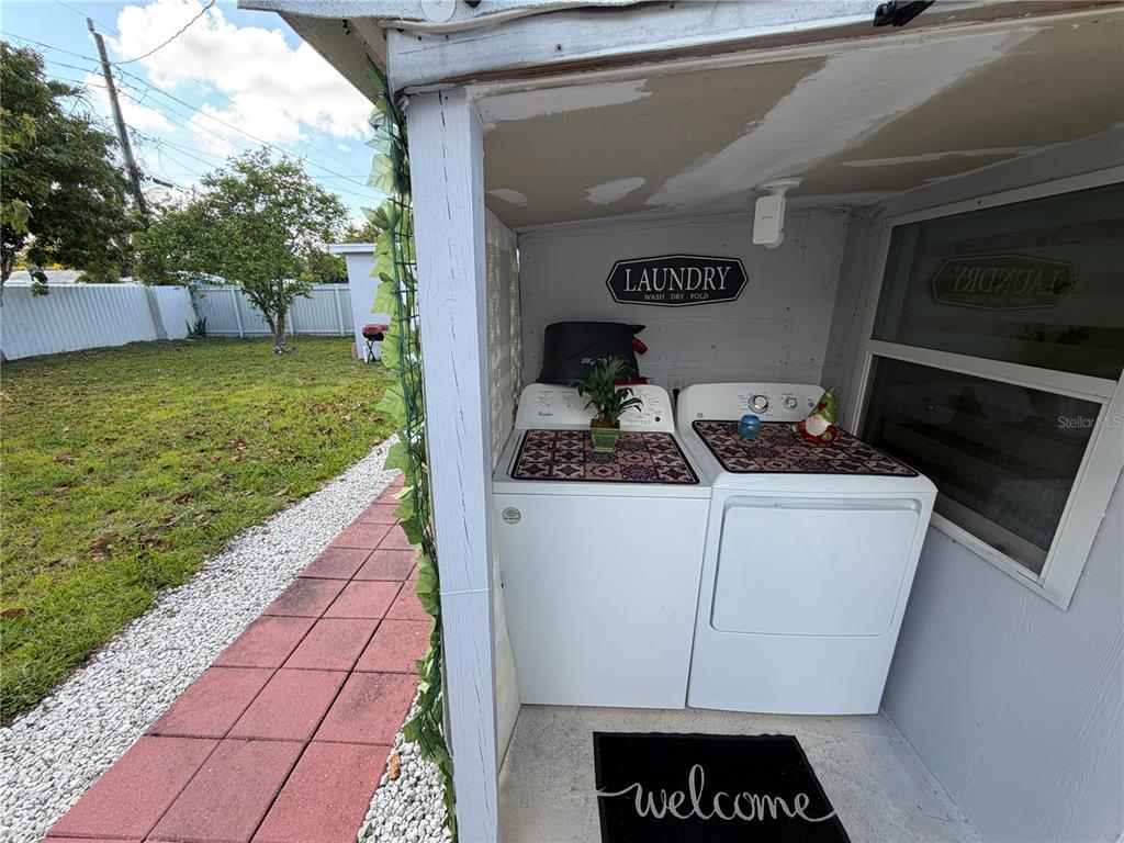 126 Miami Gardens Road West Park, FL 33023 - Photo 40 of 55 a white refrigerator freezer sitting in a yard