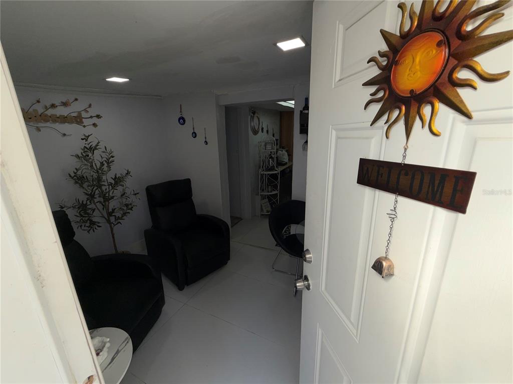 126 Miami Gardens Road West Park, FL 33023 - Photo 41 of 55 a living room with furniture and a floor to ceiling window