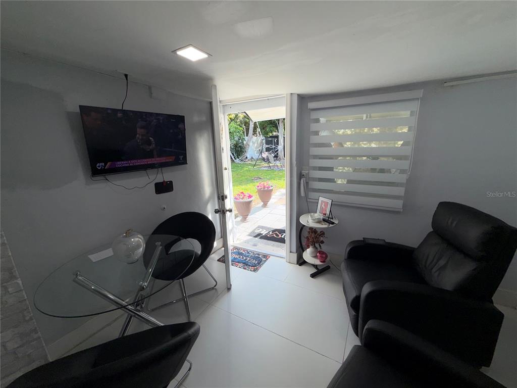126 Miami Gardens Road West Park, FL 33023 - Photo 42 of 55 a living room with furniture and a flat screen tv