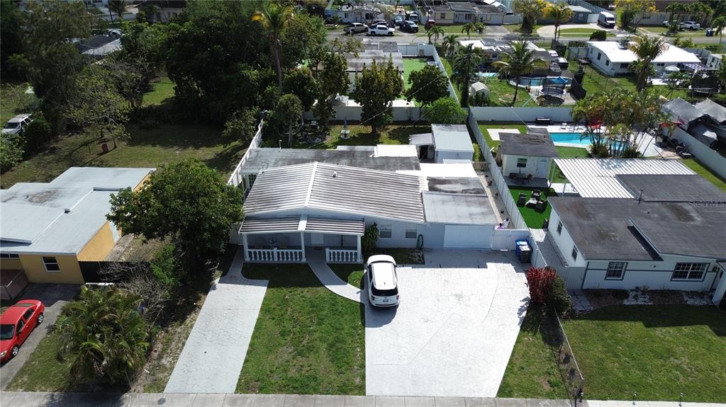 126 Miami Gardens Road West Park, FL 33023 - Photo 54 of 55 an aerial view of a house with a yard and street