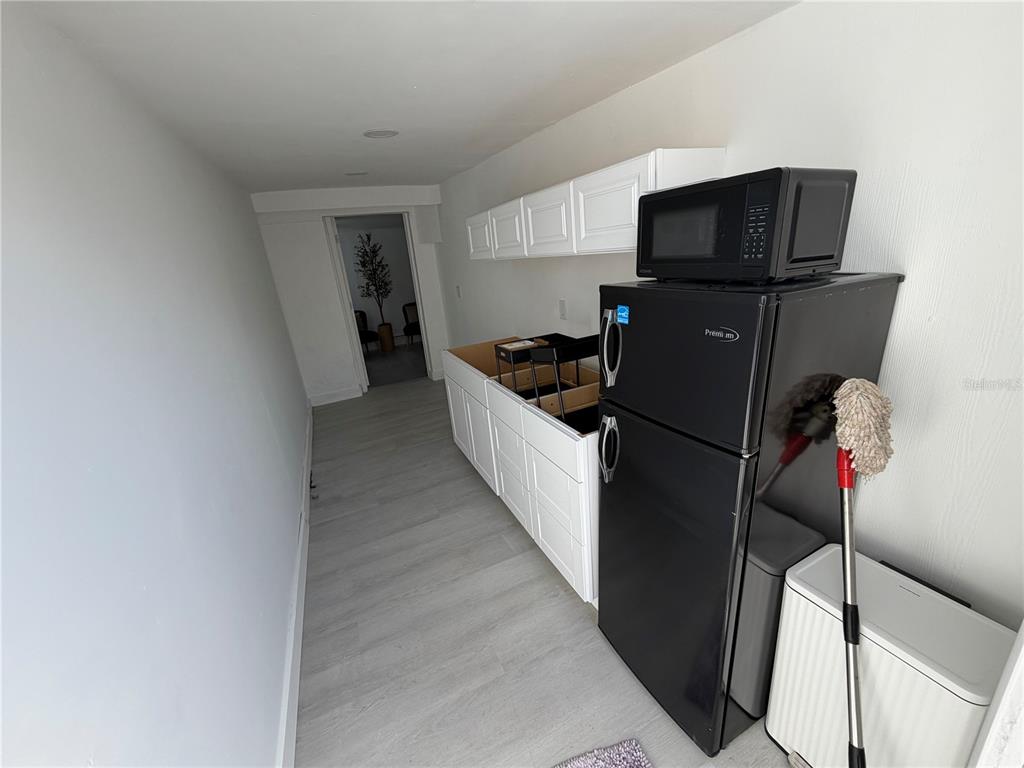 126 Miami Gardens Road West Park, FL 33023 - Photo 10 of 55 a kitchen with a sink and refrigerator